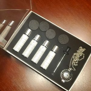 Aroma aria modern wellness essential oils and pendant necklace set.